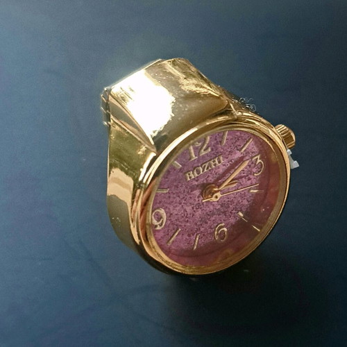 Quartz ring watch like new with purple dial and gold bracelet