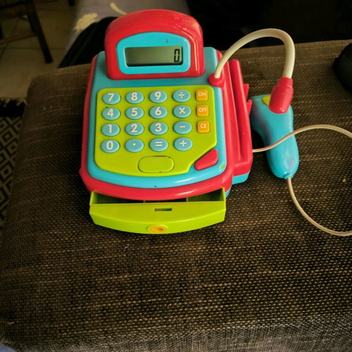 Playgo cash register used with real calculator