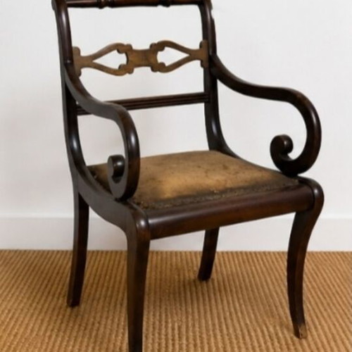 Vintage solid wood armchair with carved back used