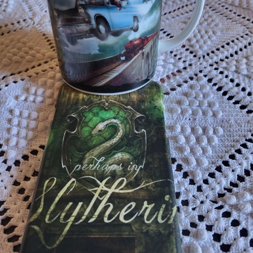 Harry Potter mug and phone case used, Hogwarts Express and Slytherin iPhone
