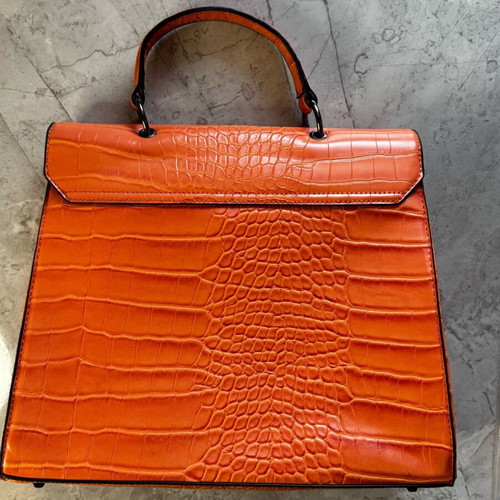 Orange shoulder bag like new made of sturdy material