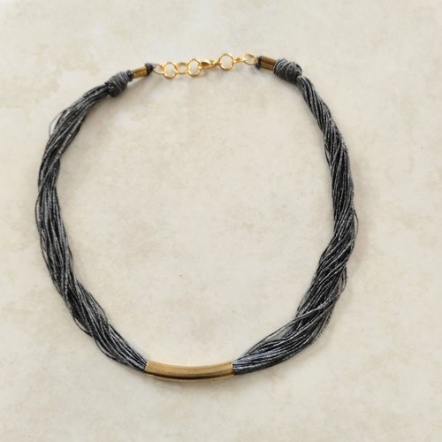 Minimal handmade necklace used, silk thread with metal element