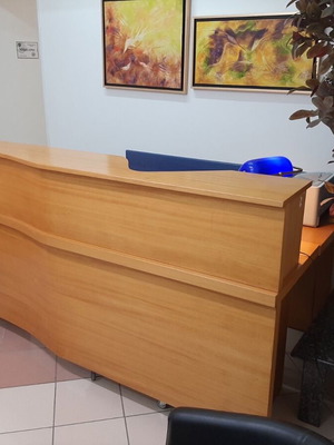 Professional reception desk used, made of beech with 4 drawers