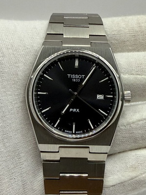 Tissot PRX Quartz watch with black dial