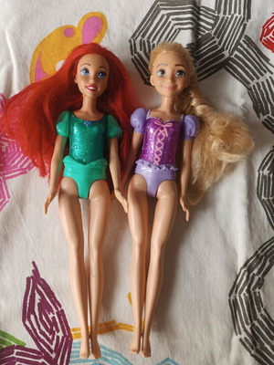 Rapunzel and Ariel dolls used with wear