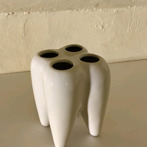 Tooth-shaped toothbrush holder unused
