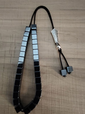 Handmade hematite worry beads with cube-shaped beads and silver shield