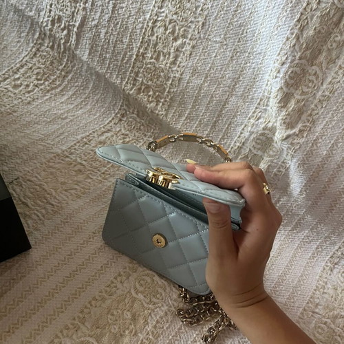 Leather baby blue handbag like new with gold chain and full packaging