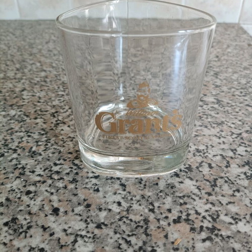 Grant's collectible glass like new with triangular shape and gold logo