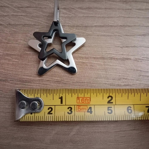 Star pendant made of steel like new, silver and black