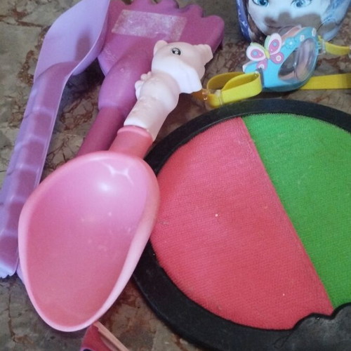 Beach items used, pack with masks, rackets, balls, bucket, sunglasses