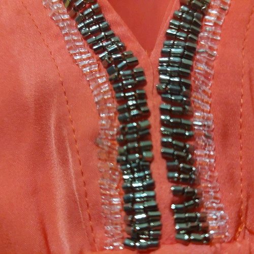 Coral satin-like blouse with V and rhinestones like new, size Medium