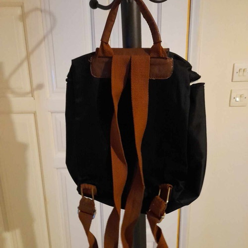 Black backpack with brown flap
