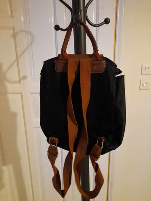 Black backpack with brown flap