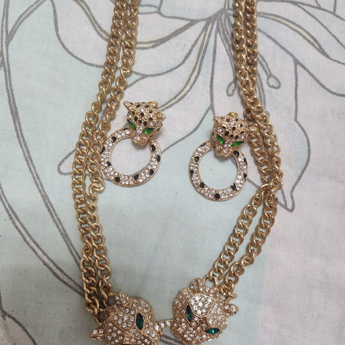 Gold-tone tiger earrings and necklace set with rhinestones
