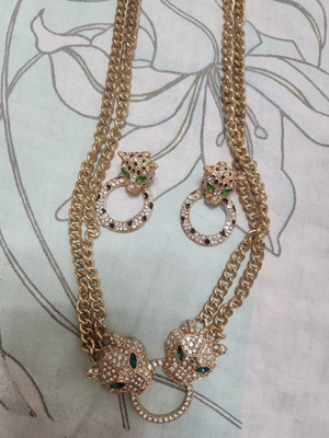 Gold-tone tiger earrings and necklace set with rhinestones