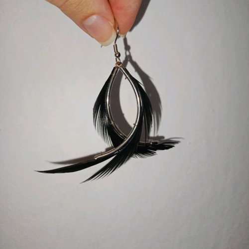 Fallen Angel earrings like new with black hanging feathers