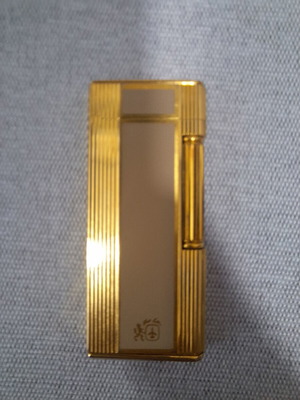 Colibri of London vintage lighter used, gold finish with beige detail