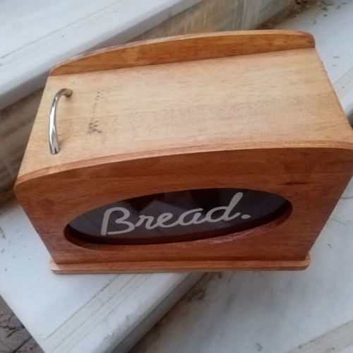 Wooden breadbox with hinged lid and metal handle used