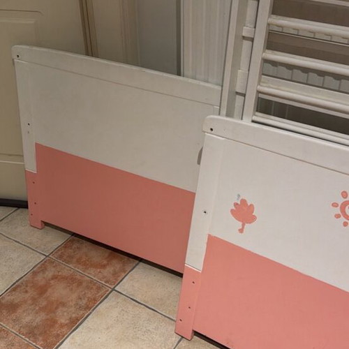 Wooden baby cot, white and pink with side rails