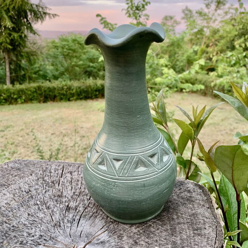 Handmade ceramic vase with carved geometric patterns, like new
