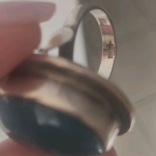 Silver large ring with petrol oval stone used