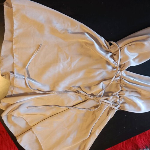 One-piece mini romper like new, gold with crisscross back