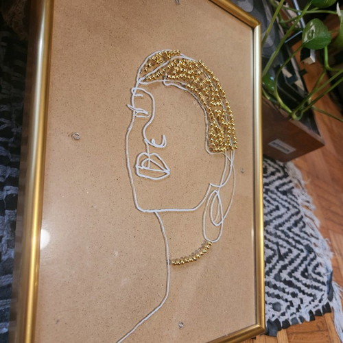 Handmade frame new with female face and golden beads