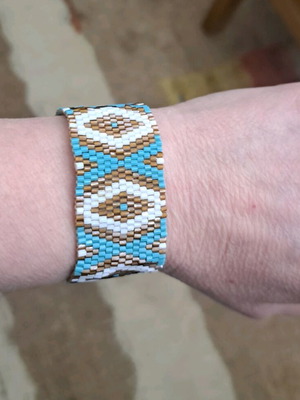 Boho summer bracelet with geometric pattern in turquoise and earth tones, new