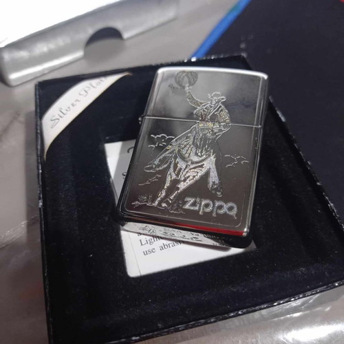 Zippo silver plate engraved "cowboy" lighter new