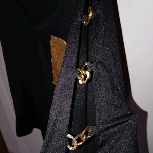 Black elastic blouse with sequin pocket and cutout, like new
