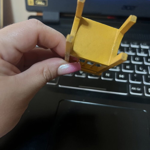 Miniature yellow chair used