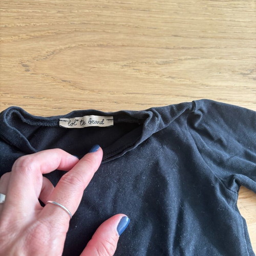 Lol the brand blouse like new, size 6-9 months, black