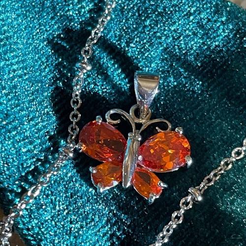 Necklace with orange butterfly pendant like new
