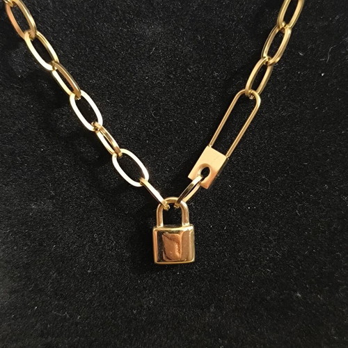 Modern necklace with decorative lock in gold color, new