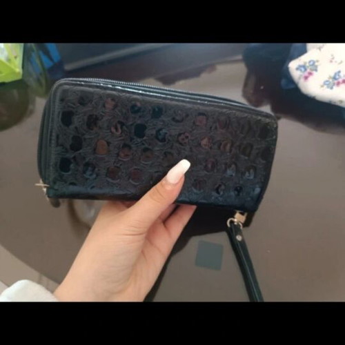 Patent leather wallet like new with embossed design and wrist strap