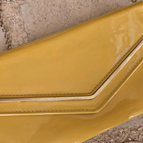 Aldo yellow vinyl clutch bag used with gold trim