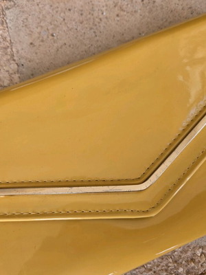 Aldo yellow vinyl clutch bag used with gold trim