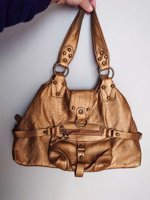 Women's handbag used, dark gold color