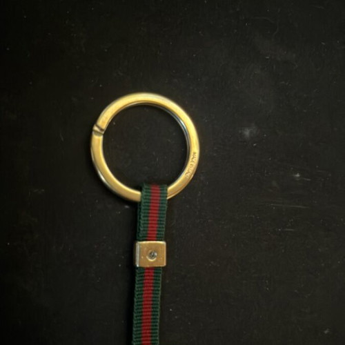 Gucci keychain like new, gold color