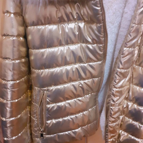 Short gold jacket with white fur and hood