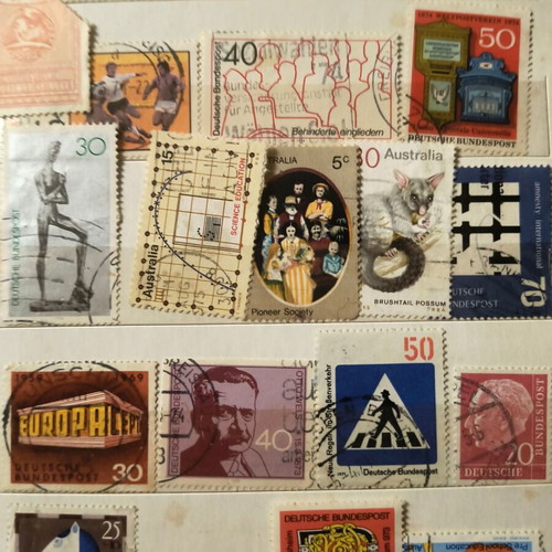 Stamp album like new with about 500 mostly foreign stamps
