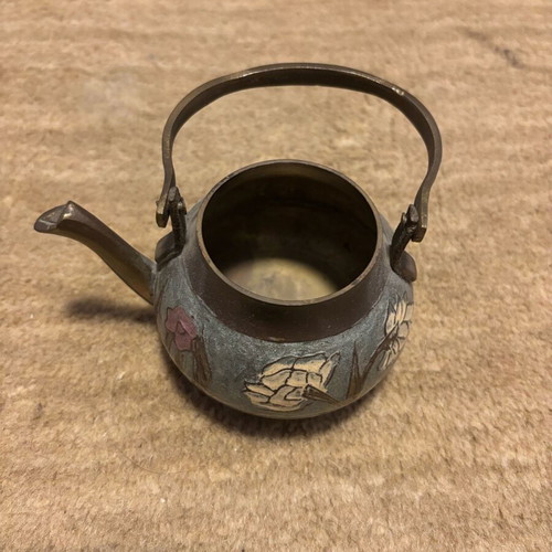 Handmade used brass decorative teapot with carved floral designs