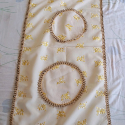 Table linens used, round tablecloth and rectangular runner
