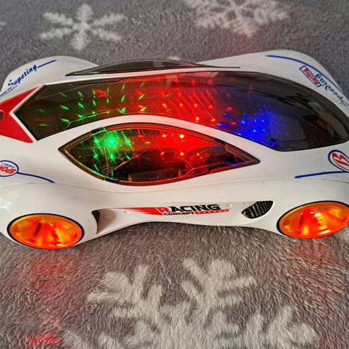 Racing car new with motion, music and lights