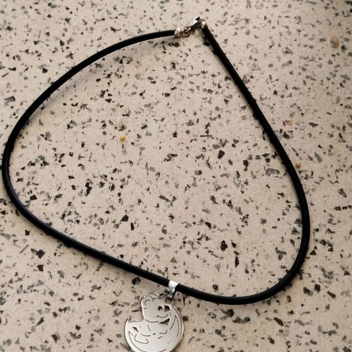 Pendant with enamel and K18 gold on rubber cord like new, steel