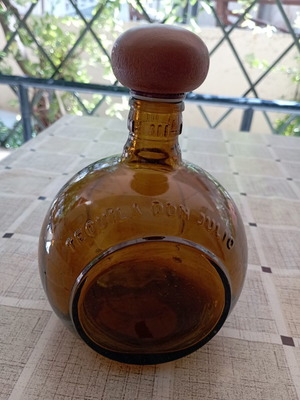Don Julio Anejo tequila round collectible bottle, amber glass