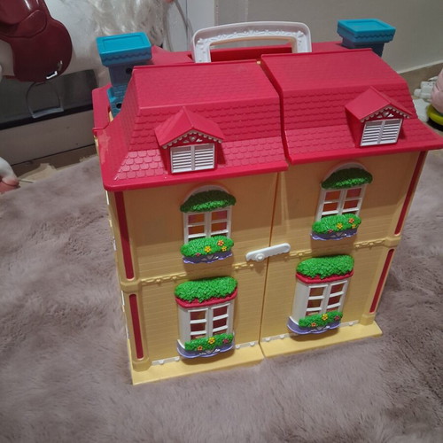 Vintage toy house with light used in good condition