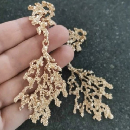 Gold statement earrings coral design