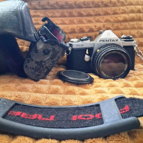 Asahi Pentax ME (1981) camera with 50mm lens and worn leather case